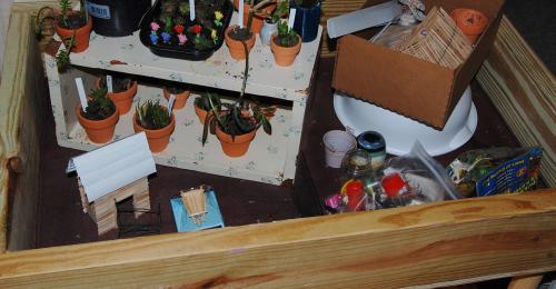 DH made this awesome table to hold the mini garden