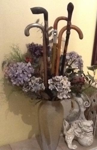 Antique walking canes and silk and dried flowers