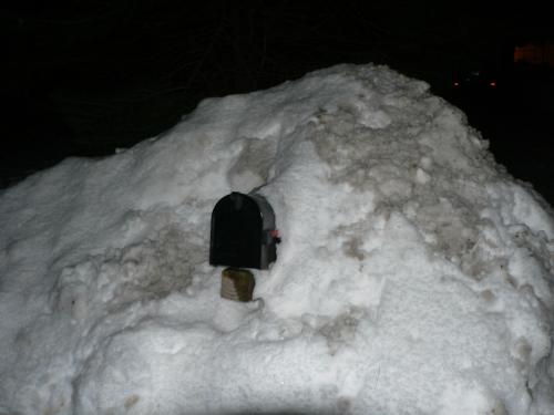 Mailbox, shoved in snow bank