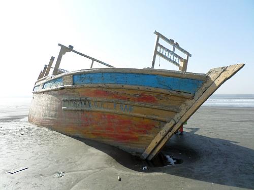 Beached fishing boat up close 1
