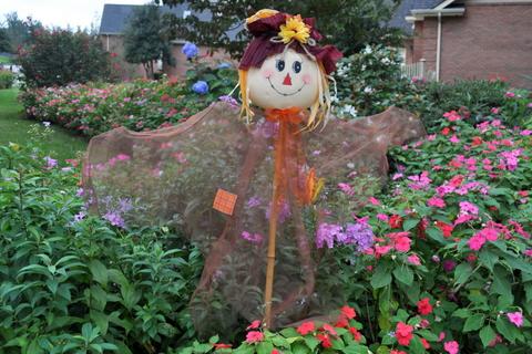 Scarecrow enjoying the garden