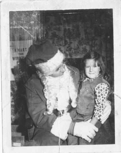 On Santa's lap as a child-would break his leg now!