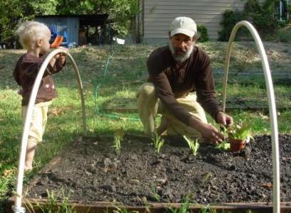 Farmer Dave planting cloche
