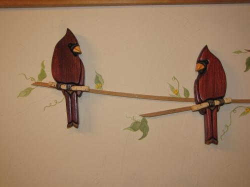 Wooden birds an a homemade branch..