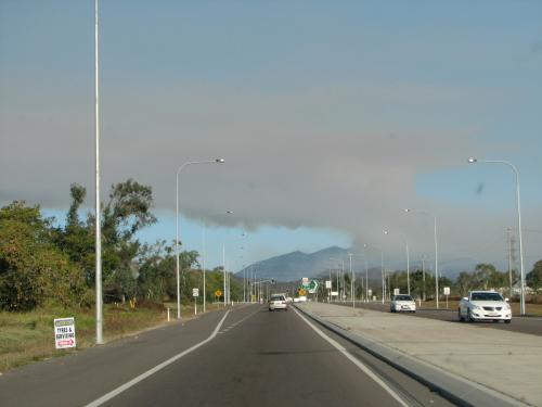 Heading home down the highway watching the plume of smoke