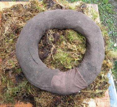 panty hose leg filled with soil and ends connected to form soil ring